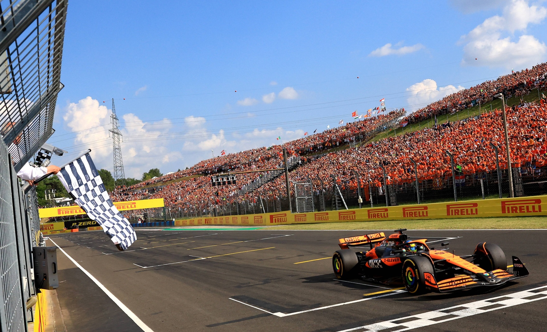 Oscar Piastri from Australia is the first to cross the finish line on the track near Budapest. 